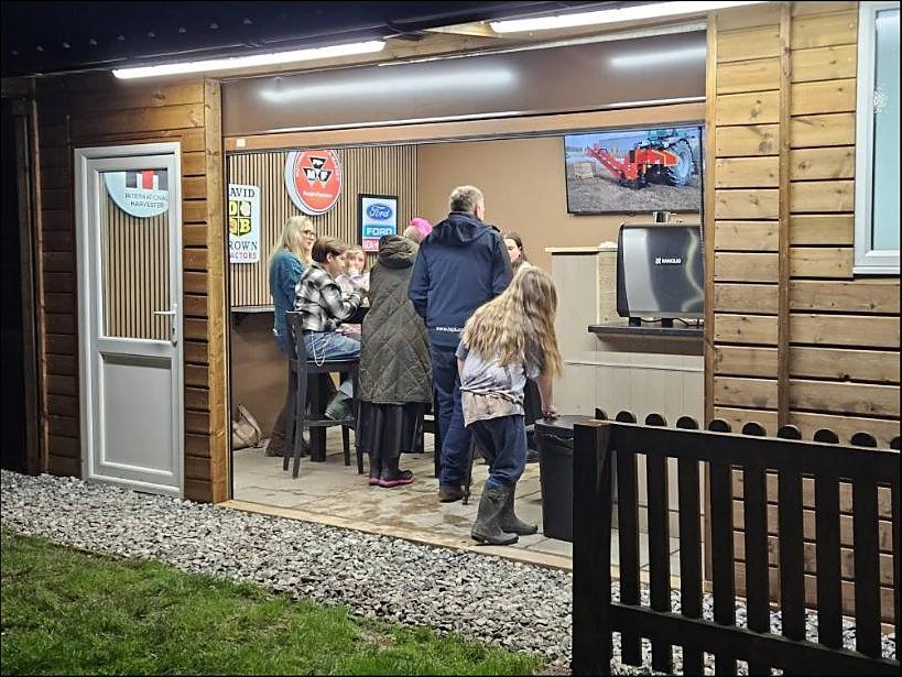 An evening gathering inside The Tractor Shed