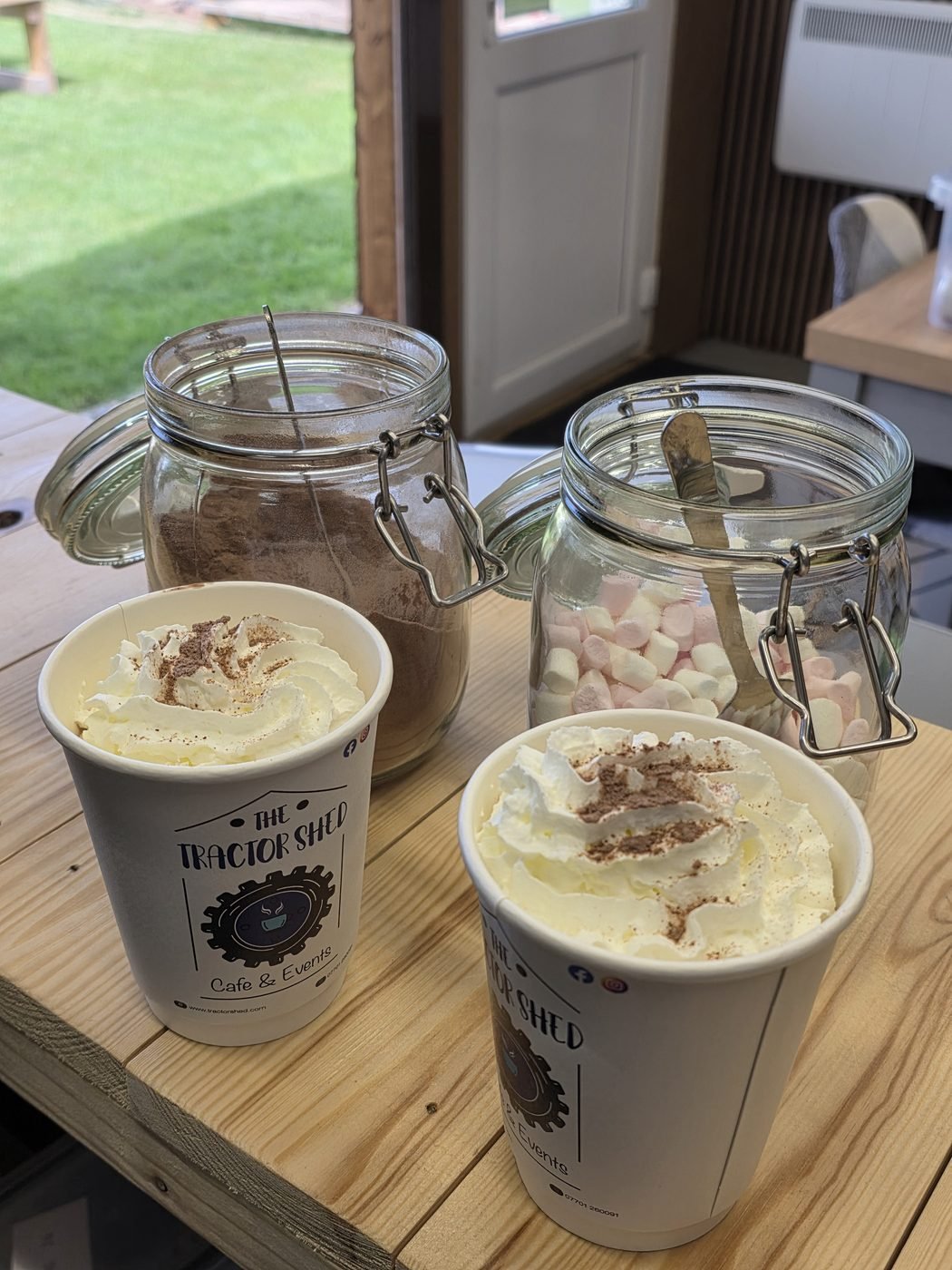 Two Tractor Shed hot chocolates piled with cream and marshmallows