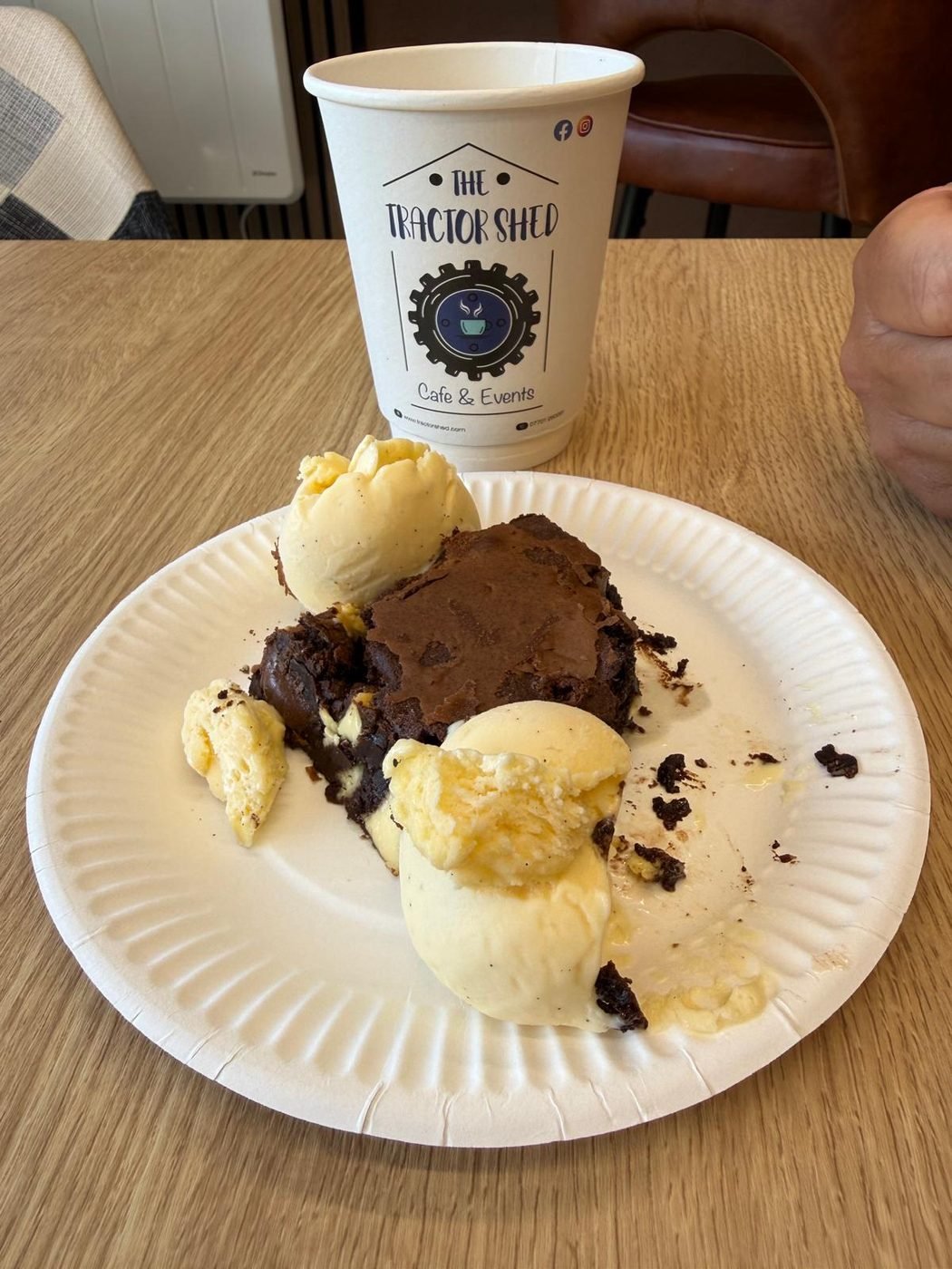 Warm brownie with ice cream and a Tractor Shed coffee